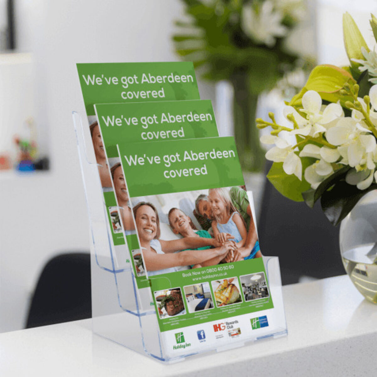 Counter standing leaflet dispenser displaying life insurance flyers.png