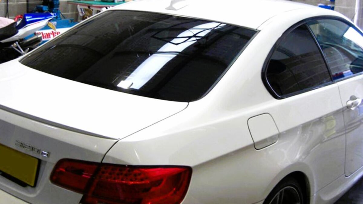 Black Out Window Tint Applied To Rear Window and Rear Side Windows On Car
