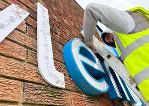 Attaching 3D lettering with white acrylic faces to LED mounts on brick wall