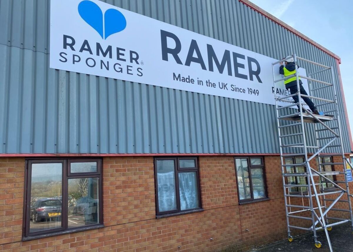 Installing new large ACM panel sign for Ramer Ltd.jpg