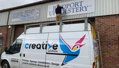 Business signs at Bridport Upholstery