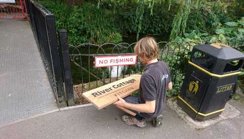 Installing new signs at The River Cottage