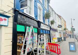 Before Enhancing Footeprints' Storefront with a Fujifilm Photo Shop Fascia Sign and Custom Window Graphics