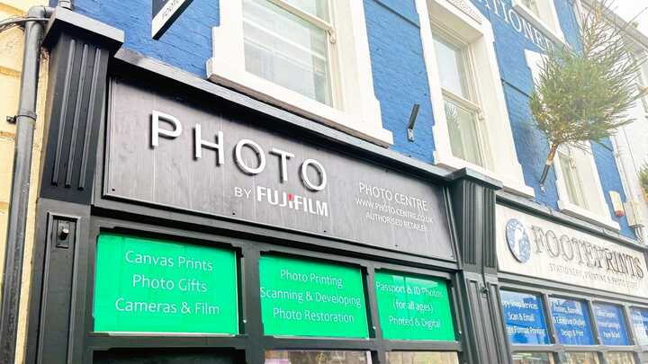 Enhancing Footeprints' Storefront with a Fujifilm Photo Shop Fascia Sign and Custom Window Graphics