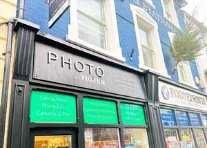 After Enhancing Footeprints' Storefront with a Fujifilm Photo Shop Fascia Sign and Custom Window Graphics