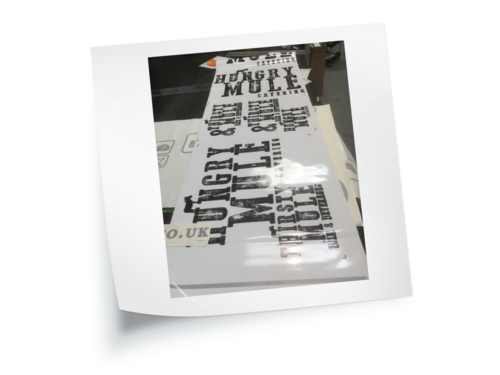 Vehicle graphics being printed ready for installation