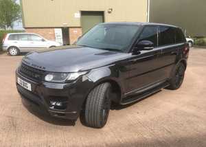 A car, vinyl-wrapped in a grey colour A car, vinyl-wrapped in a grey colour