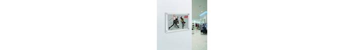 Acrylic frames wall mounted for retail.jpg