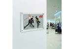 Acrylic frames wall mounted for retail.jpg