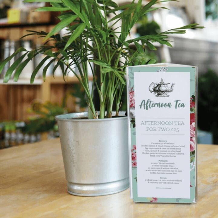 Acrylic Table Talkers displaying promotional material.png