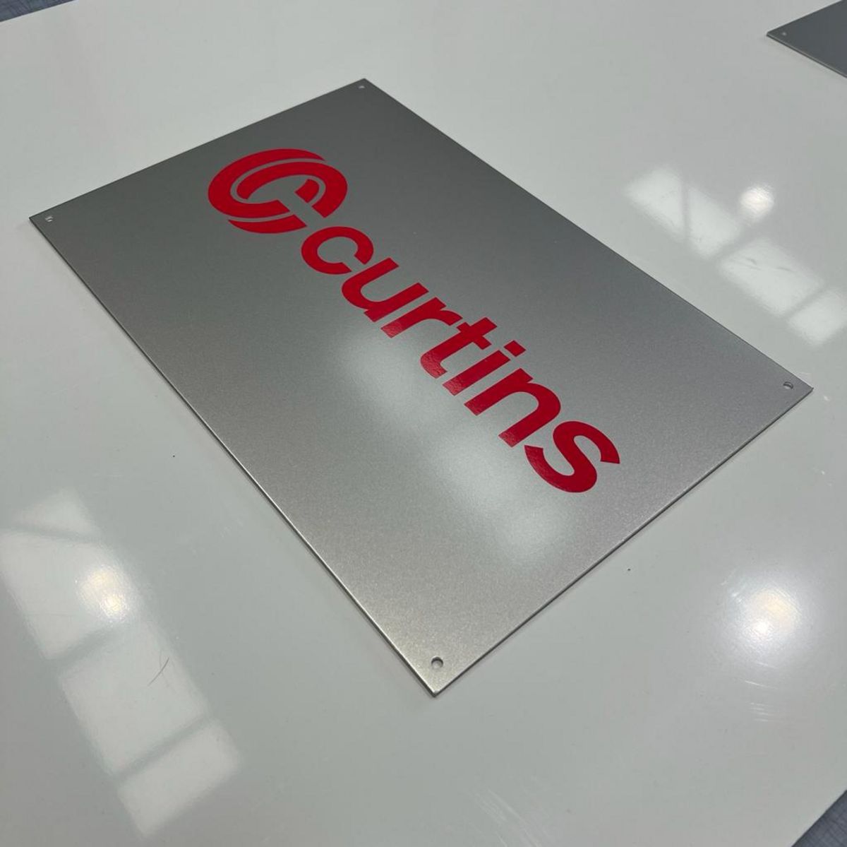 Aluminium Wall Sign - Red lettering in vinyl applied to face.jpg