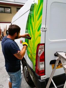 Applying Vehicle Wrap Film on Van for Vehicle Branding.jpg