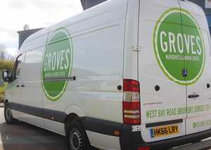 A white van with "GROVES" logo in green on the side, parked in a lot.