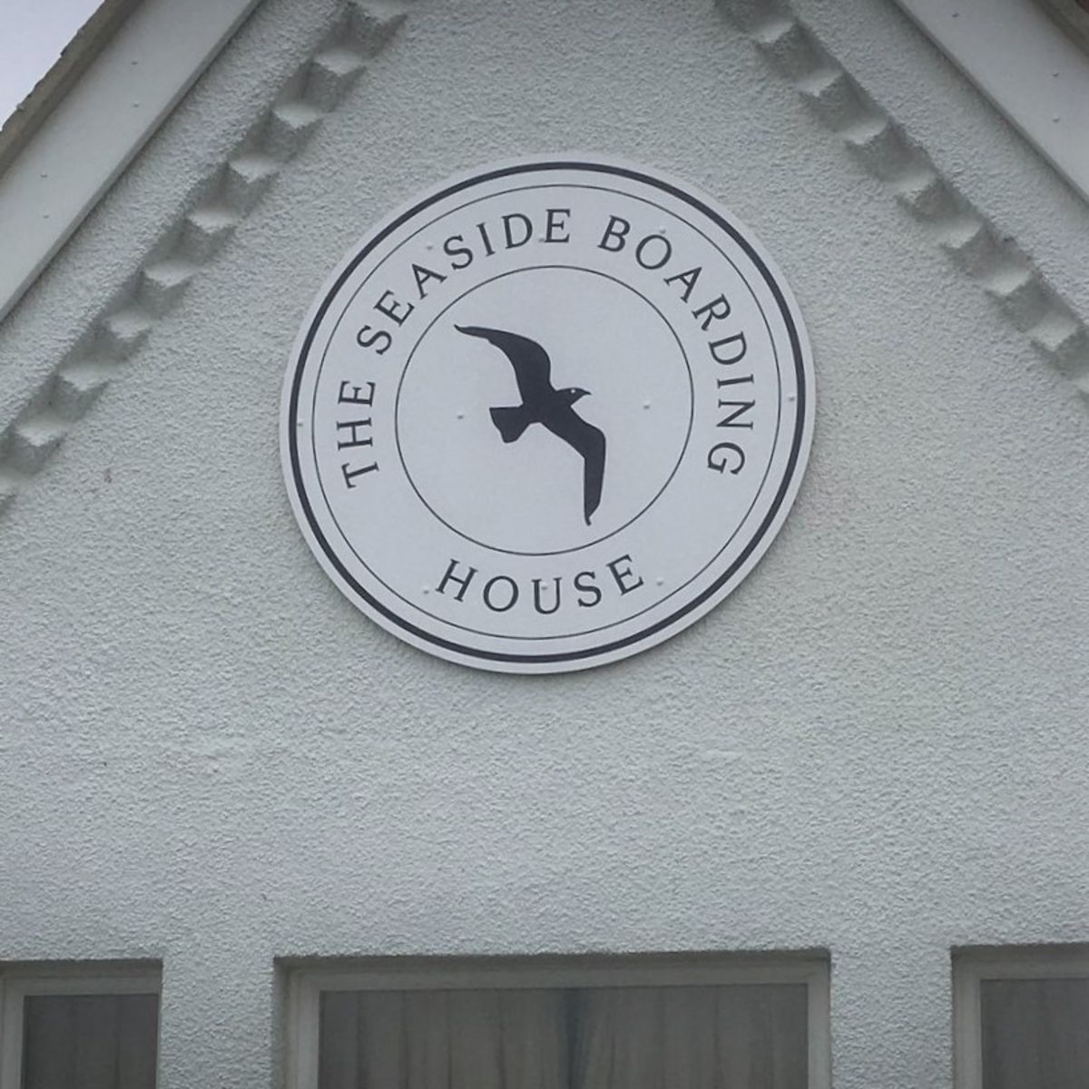 Circular Aluminium Sign for The Seaside Boarding House (2).jpg