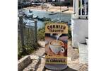cornish_tea_ecoflex_2_outside_a_coffee_shop_with_the_sea_and_boats_in_the_background.jpg