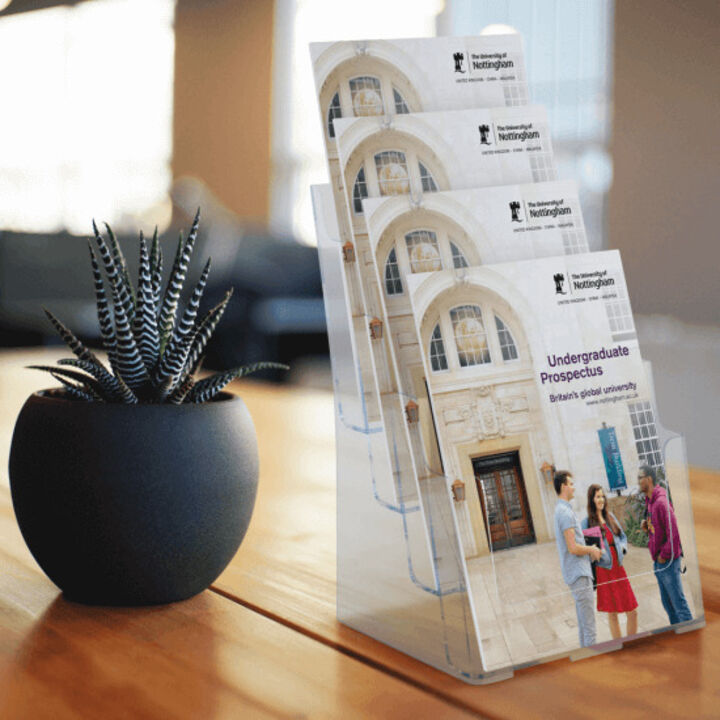 Countertop leaflet holders displaying university prospectuses.png