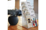 Countertop leaflet holders displaying university prospectuses.png