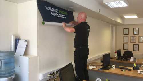 Installing Wallpaper at Estate Agents Premises