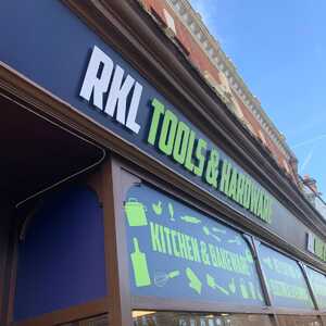Storefront sign for RKL Tools & Hardware, featuring kitchen and garden icons.