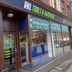 Storefront of RKL Tools & Hardware, featuring large windows and signage.