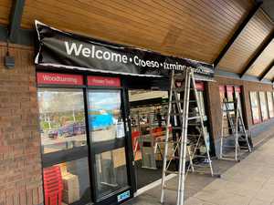 Placing the new PVC Banner over the Tray Sign
