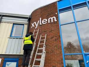 Illuminated Lettering LED Mounts applied to brick building