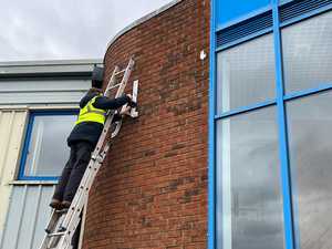 Attaching LED mounts to brick wall for illuminated lettering