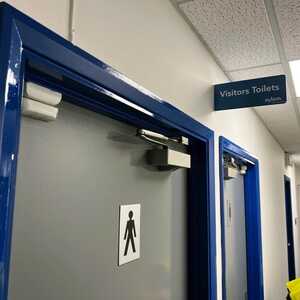 Visitor Toliets Door and wall directional signage