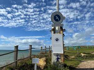 Circular Branded Logo Sign Fixed To Flag Pole Above An Aluminium Sign Including Sliding Panel