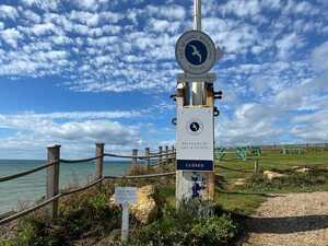 Circular Branded Logo Sign Fixed To Flag Pole Above An Aluminium Sign Including Sliding Panel