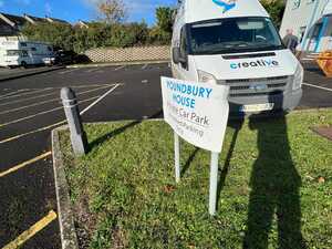 Old Failing Parking Signage Being Removed