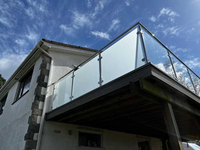 Finished frosted window film application on glass balcony