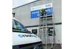 Installing Large Printed Aluminium Sign Panel on Scaffolding for Exeter Mobility Centre.jpg