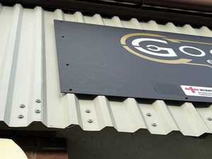 Checking Seamless Finish & Wrapped Edges Installing Sign to Prefabricated Steel Industrial Building Workshop