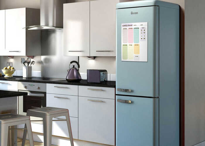 Kitchen scene with personalised whiteboard on fridge