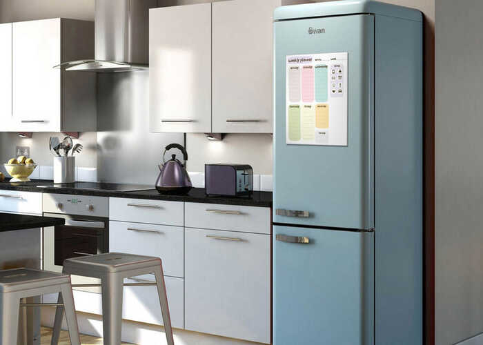 Kitchen scene with personalised whiteboard on fridge Kitchen scene with personalised whiteboard on fridge