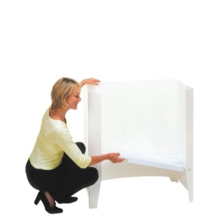 Lady adding a storage shelf to the back Demo Center promotional display counter.jpg