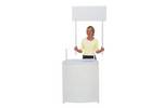 Lady adding Demo Center header and poles to the counter top of the promotional display..jpg
