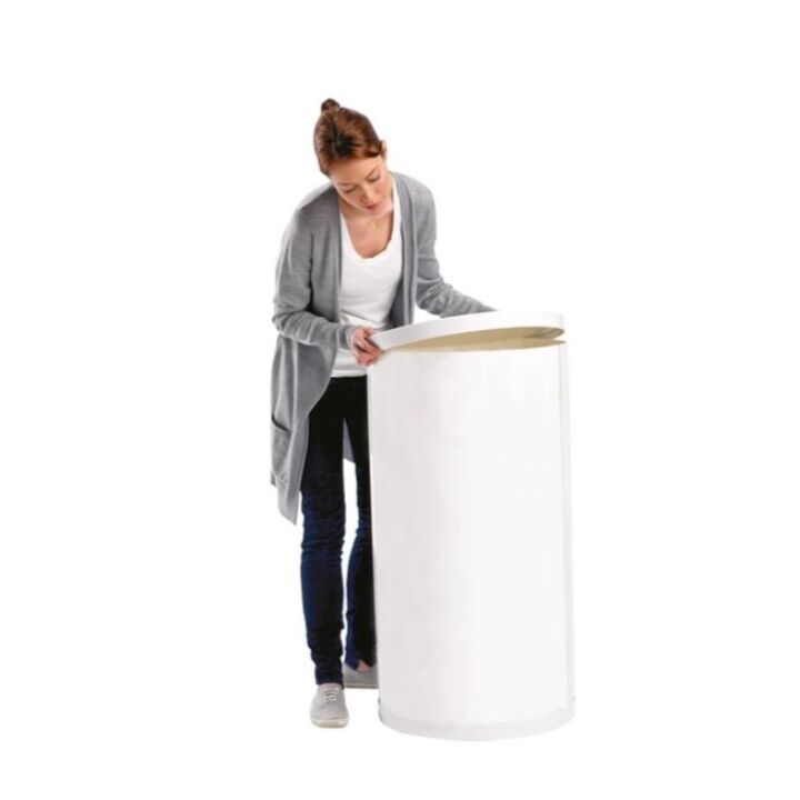 Lady adding inner moulding to the body panel of the Swift 360 promotional display counter.jpg