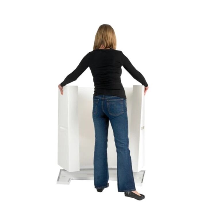 Lady adding the Action body panel to the bottom of the promotional display counter back.jpg