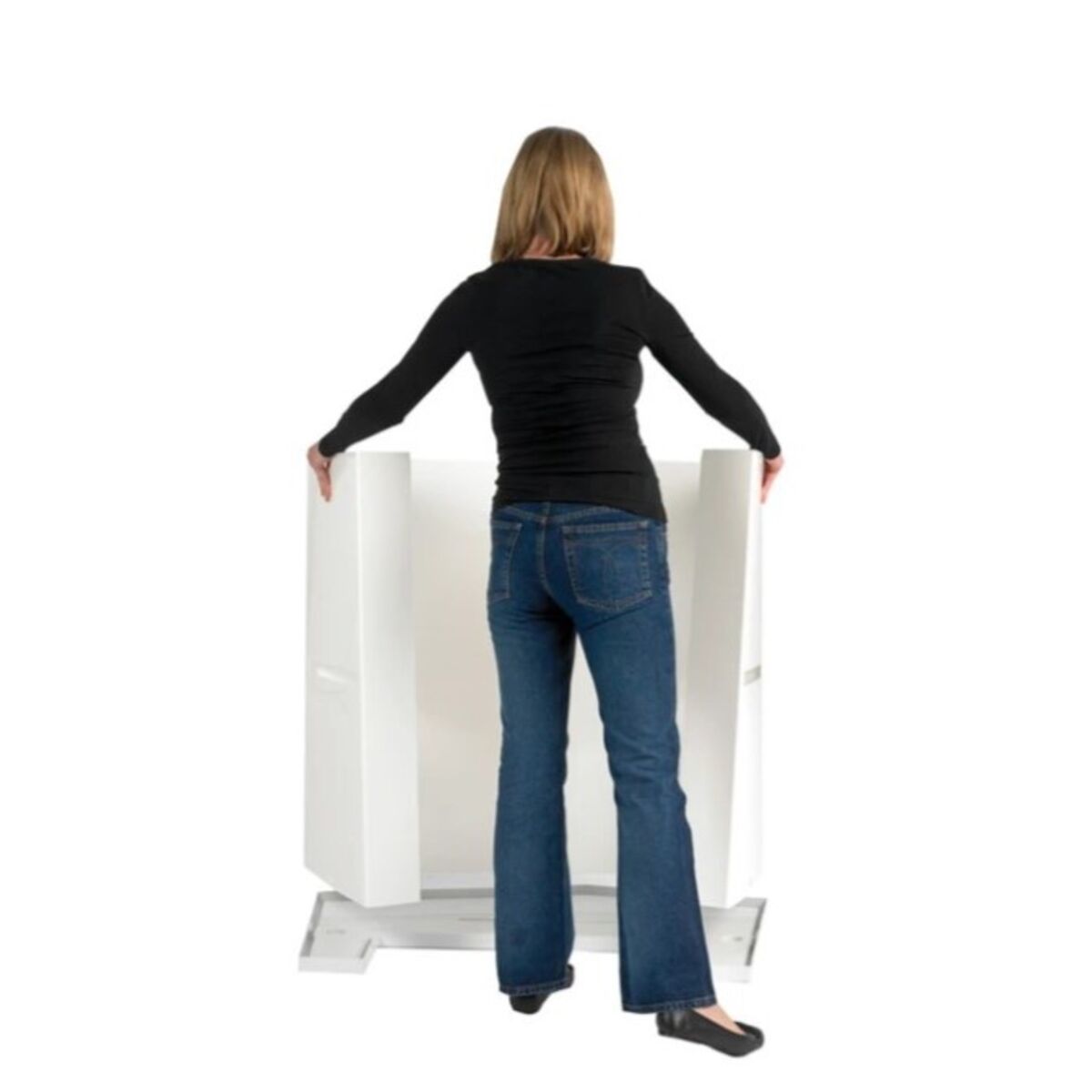 Lady adding the Action body panel to the bottom of the promotional display counter back.jpg