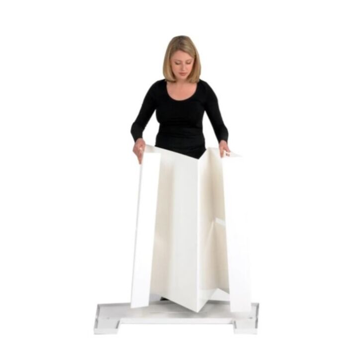 Lady adding the Action body panel to the bottom of the promotional display counter..jpg