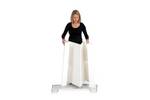Lady adding the Action body panel to the bottom of the promotional display counter..jpg