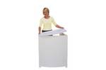 Lady adding the Demo Center counter top to the body panel of the promotional display counter..jpg