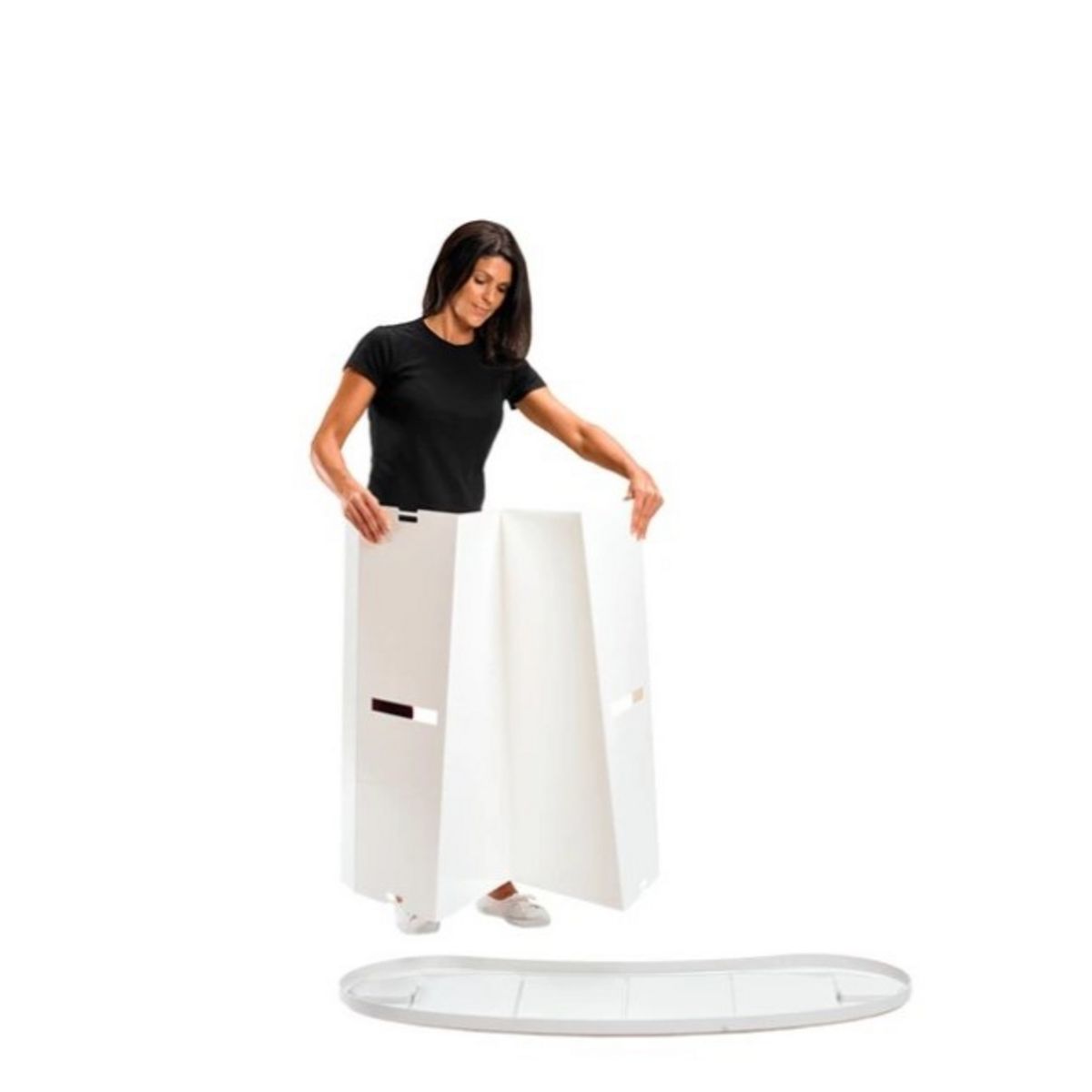 Lady adding the Finesse body panel to the bottom of the promotional display counter..jpg