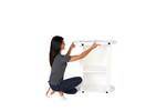Lady adding the inner top to the Finesse2 promotional display counter..jpg