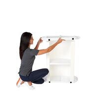 Lady adding the inner top to the Finesse2 promotional display counter..jpg