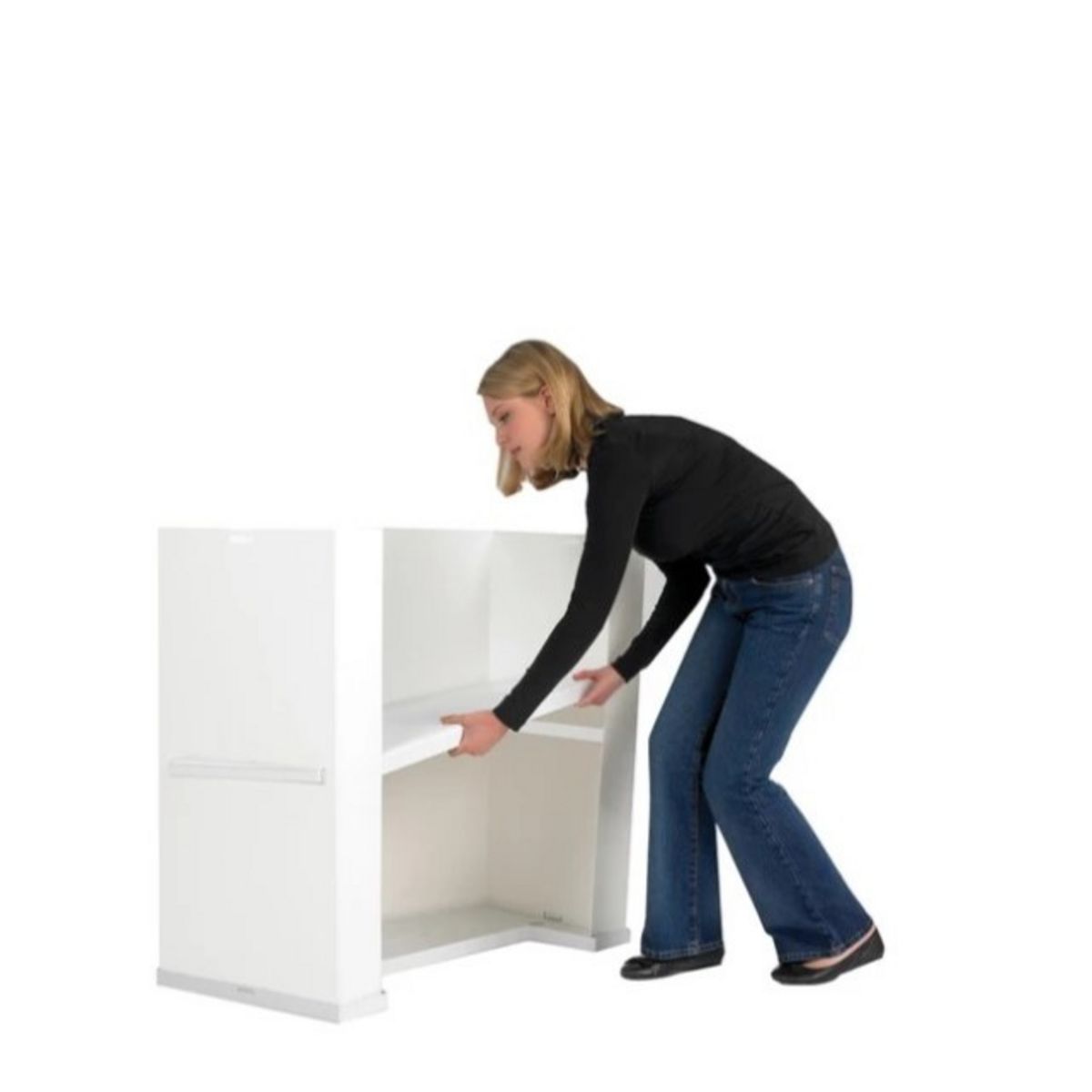 lady adding the storage shelf to the Action promotional display counter.jpg