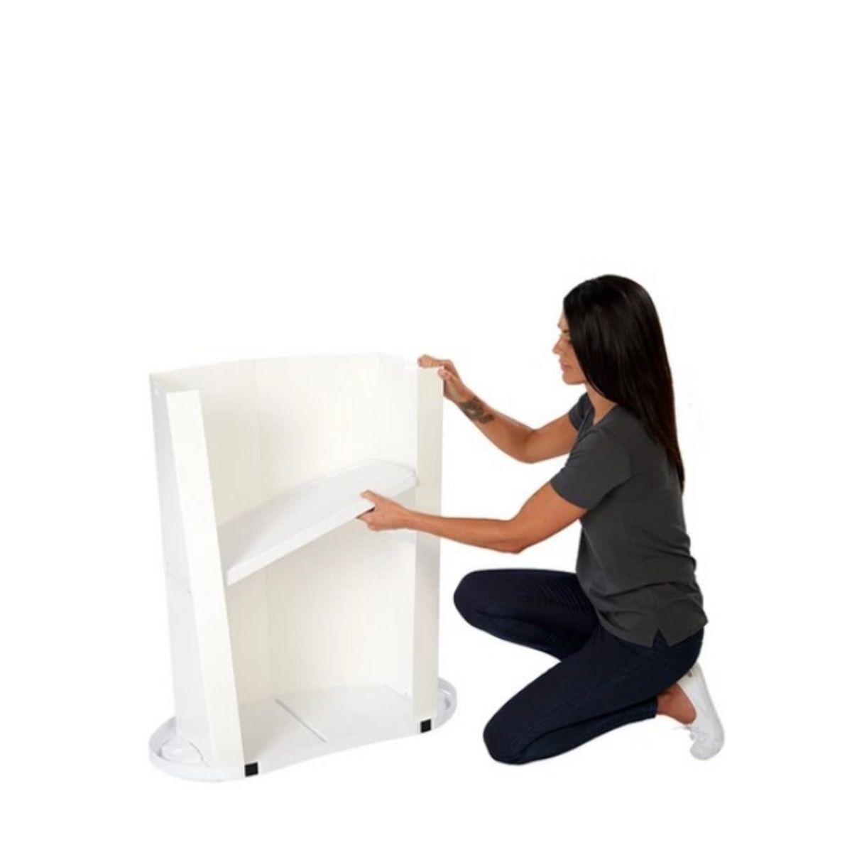 Lady adding the storage shelf to the Finesse2 promotional display counter.jpg