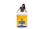 Lady adding the white counter top to the Finesse2 promotional display counter..jpg